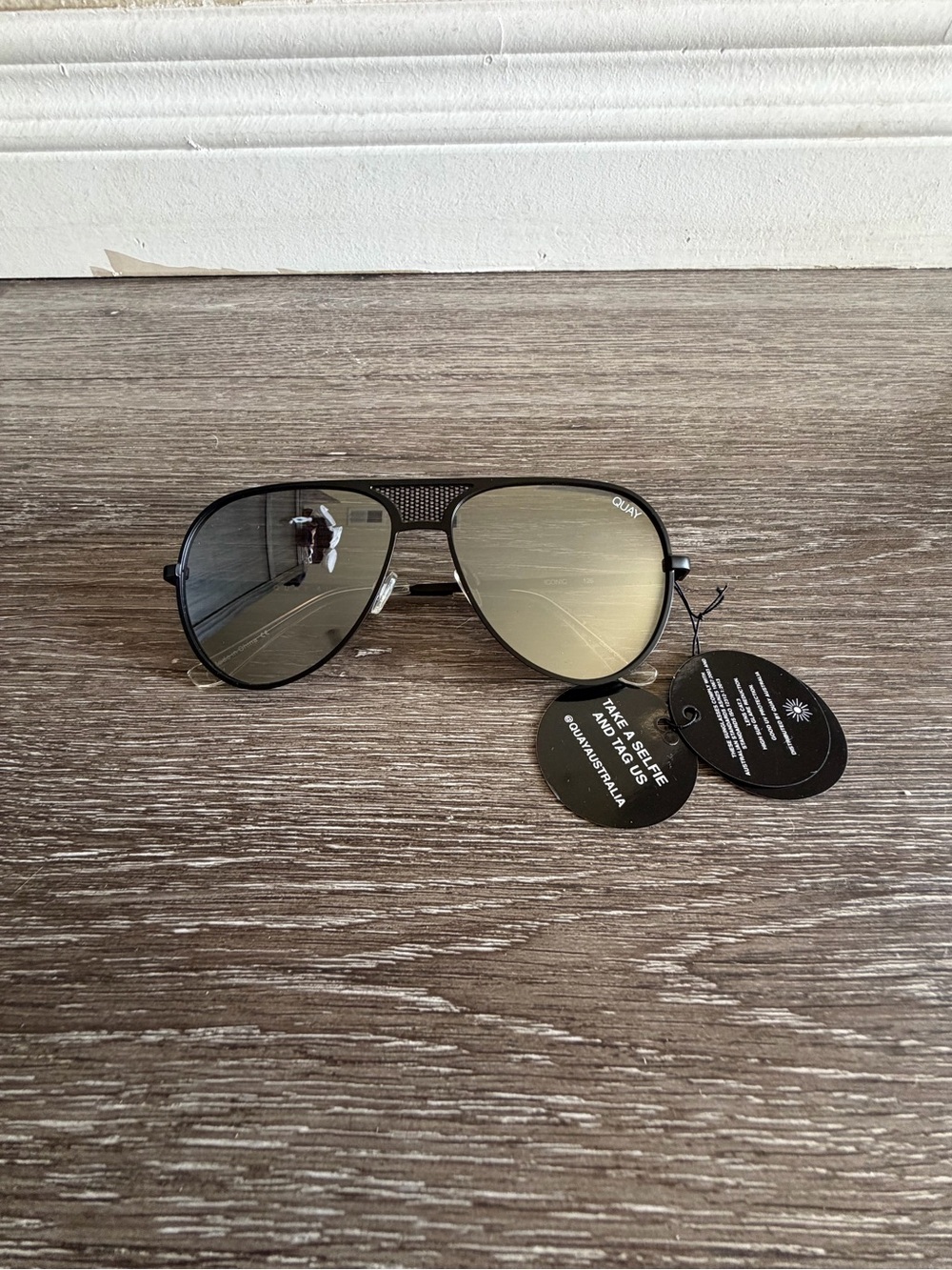 Sunglasses on wooden surface